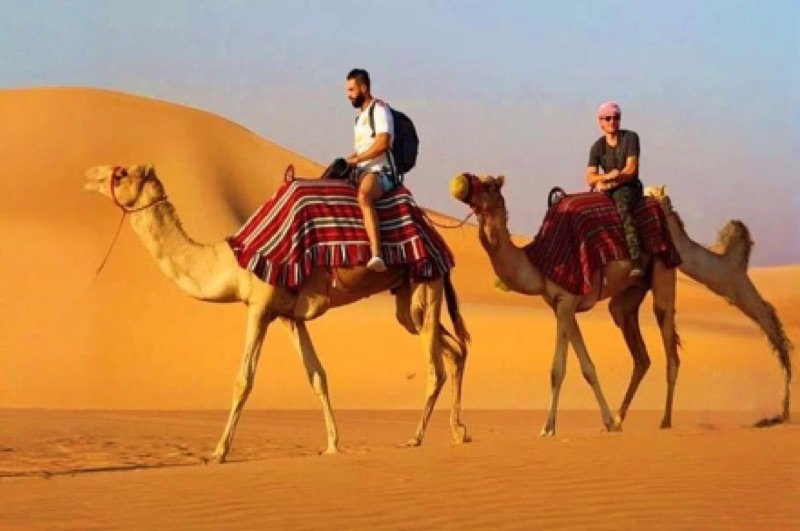 Camel ride in the desert