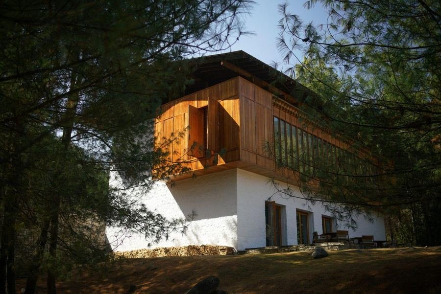 Amankora Paro lodge among pine trees