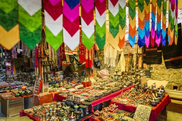 Colourful traditional textiles and souvenirs at a Thimphu market