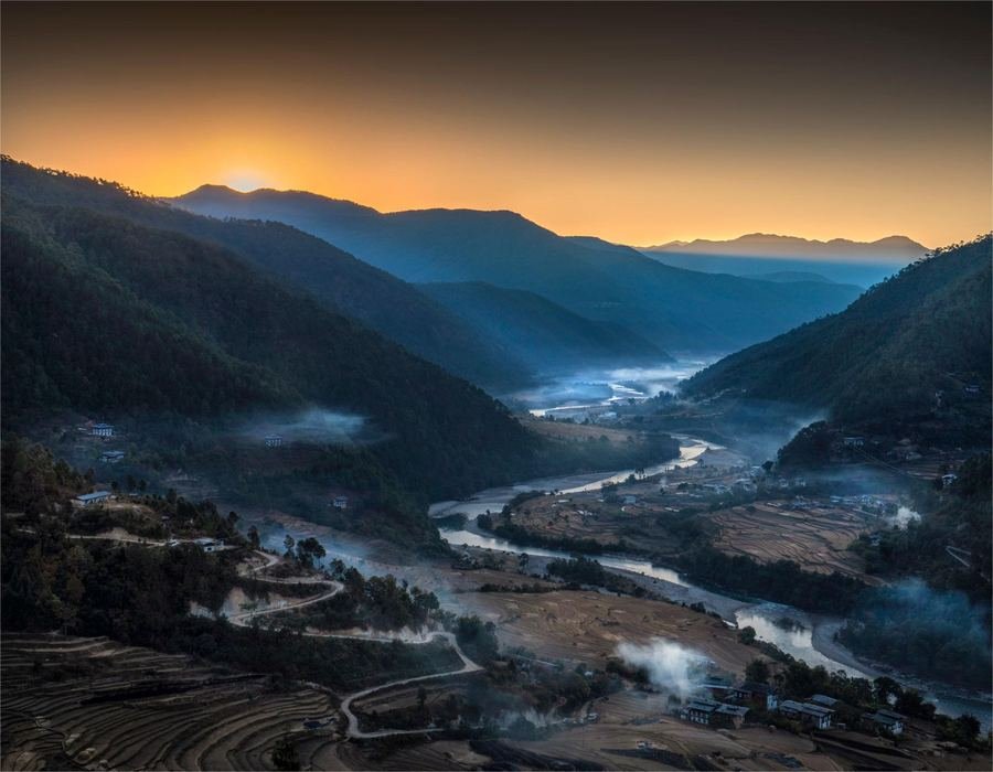 Dawn mist over a Bhutanese valley