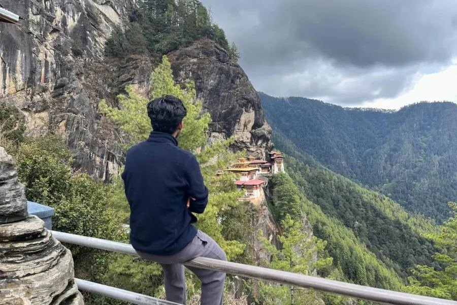 Visitor looking across to Tiger&rsquo;s Nest from a viewpoint