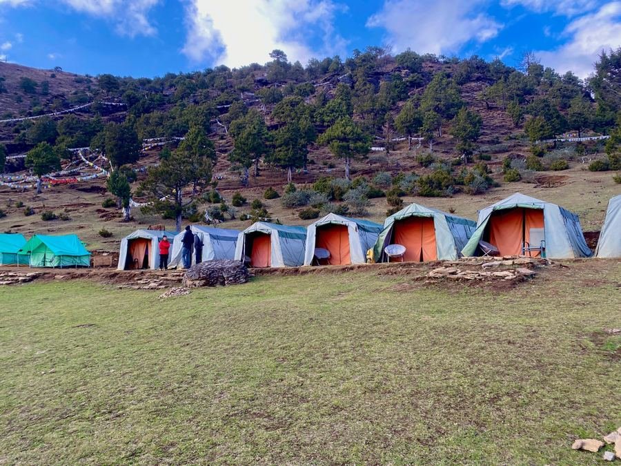 Trekking camp on a hillside above the valley
