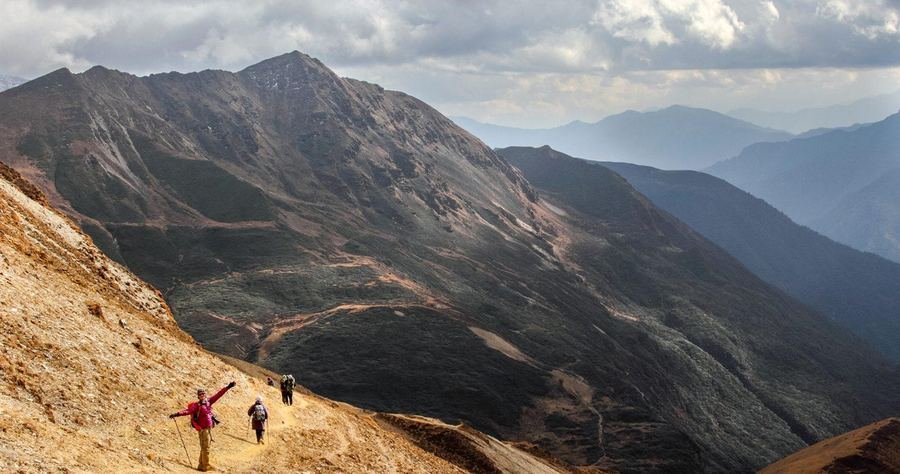 Trekker on a high open ridge trail