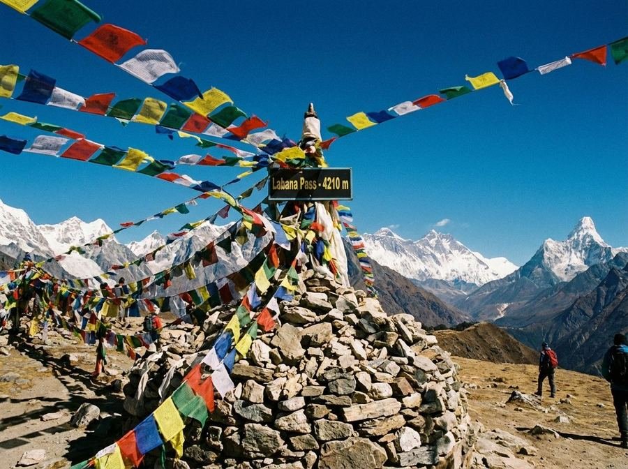 Prayer flags and a cairn on a high Himalayan pass