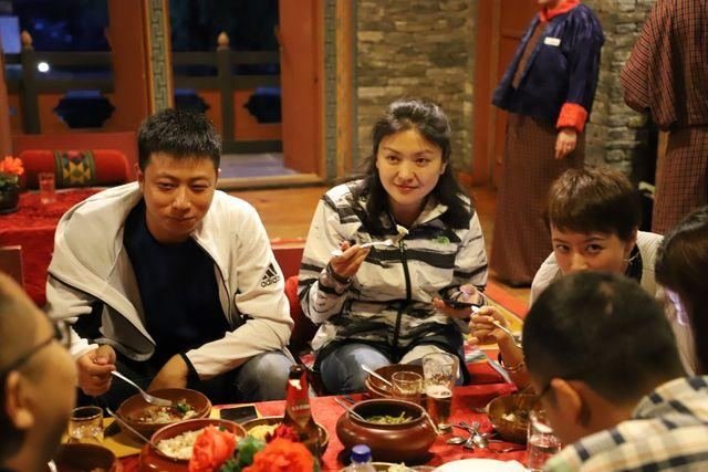 Family sharing a traditional Bhutanese meal