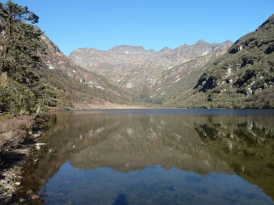 Alpine lake reflecting the surrounding mountains