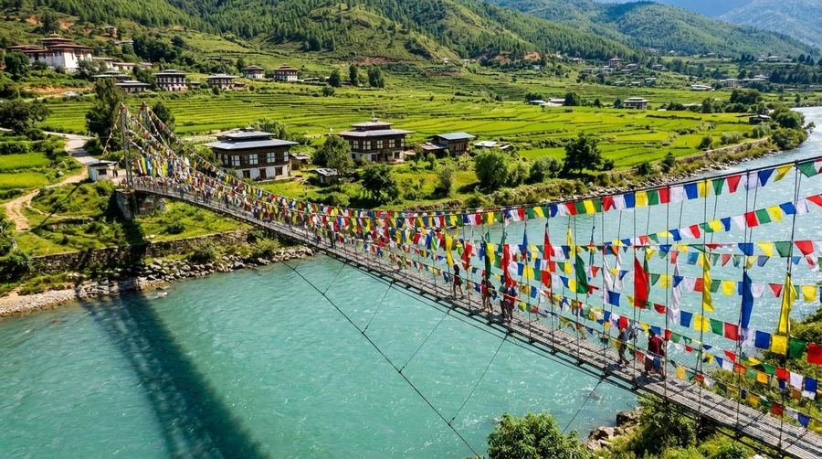 Punakha suspension bridge hung with prayer flags