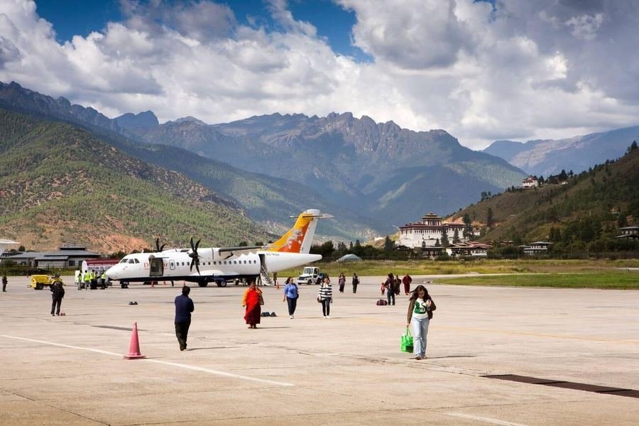 Passengers crossing the apron at Paro airport