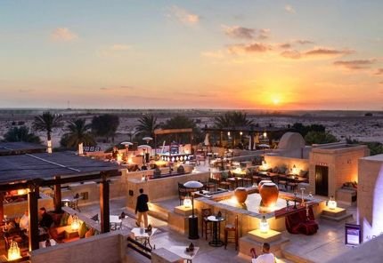 Desert resort terrace at sunset