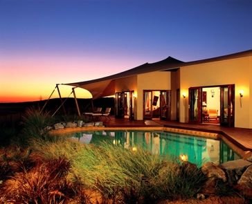 Private-pool desert villa at dusk