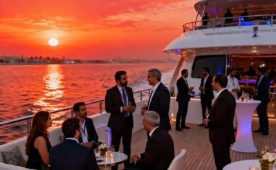 Networking reception aboard a Dubai Marina yacht at sunset