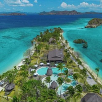 Aerial view of a Coron beach resort on turquoise shallows