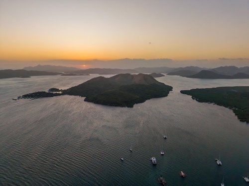 Sunrise over the islands of Coron Bay seen from the air