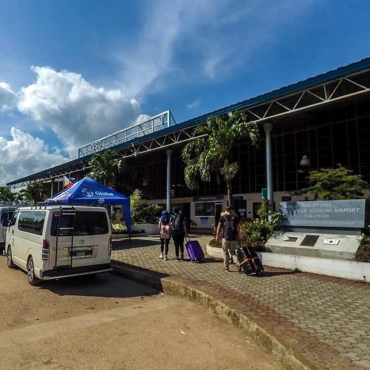 Guests and transfer van outside Busuanga airport terminal