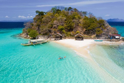 Turquoise shallows and sandbar around a tropical island near Coron