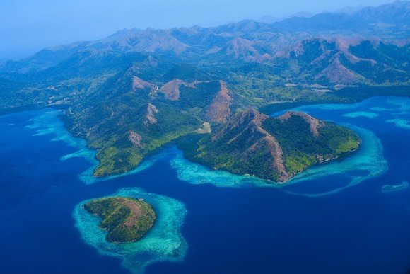 Aerial view of Coron&rsquo;s green islands and reef-fringed shallows