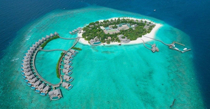 Aerial view of Milaidhoo island and its house reef
