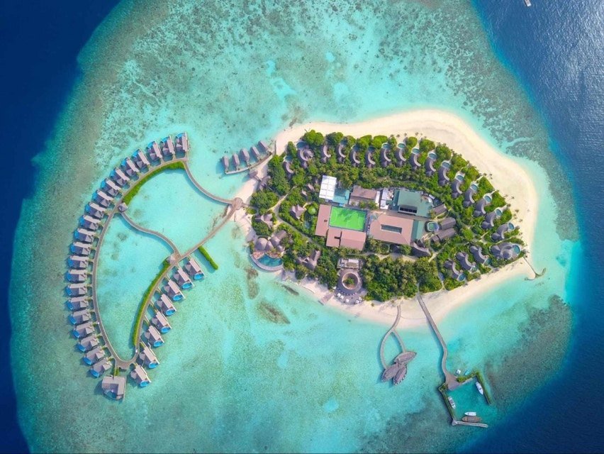 Aerial view of Milaidhoo island and its house reef, Baa Atoll