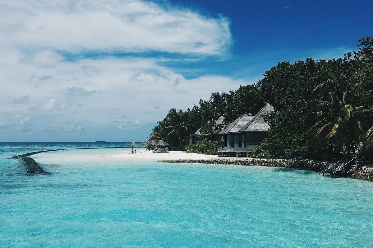 Gangehi Island Resort villas beside the lagoon, North Ari Atoll
