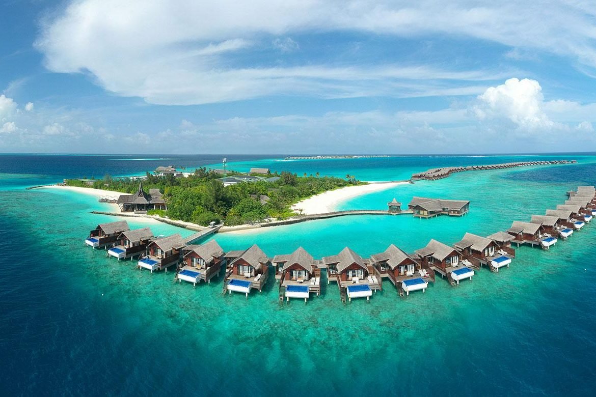 Aerial view of Olhuveli Beach & Spa Resort and its overwater villas, South Malé Atoll