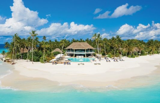 Luxury beachfront restaurant at Baglioni Resort Maldives in Dhaalu Atoll, featuring open-air dining with ocean views, elegant Italian décor, and fine dining cuisine.